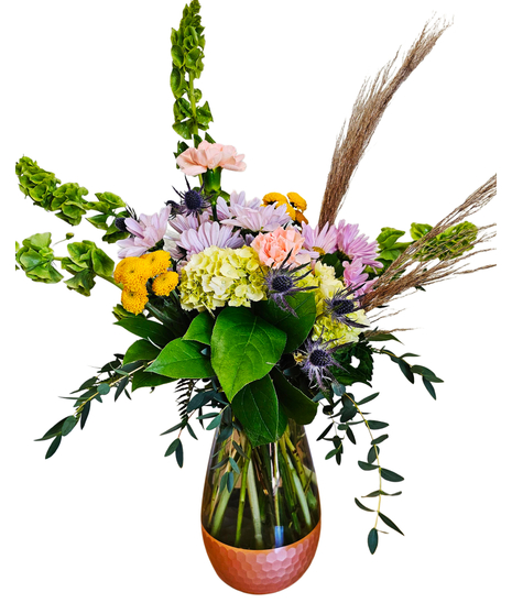 A copper bottomed vase with bells of Ireland, peach carnations, green hydrangea, lavender daisies and yellow buttons